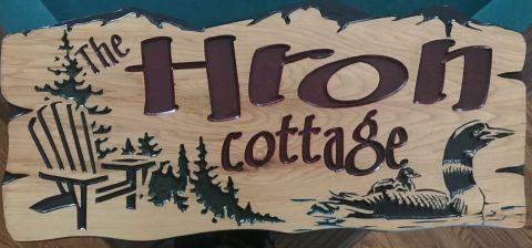Moutains, chair, loon, wooden cottage sign